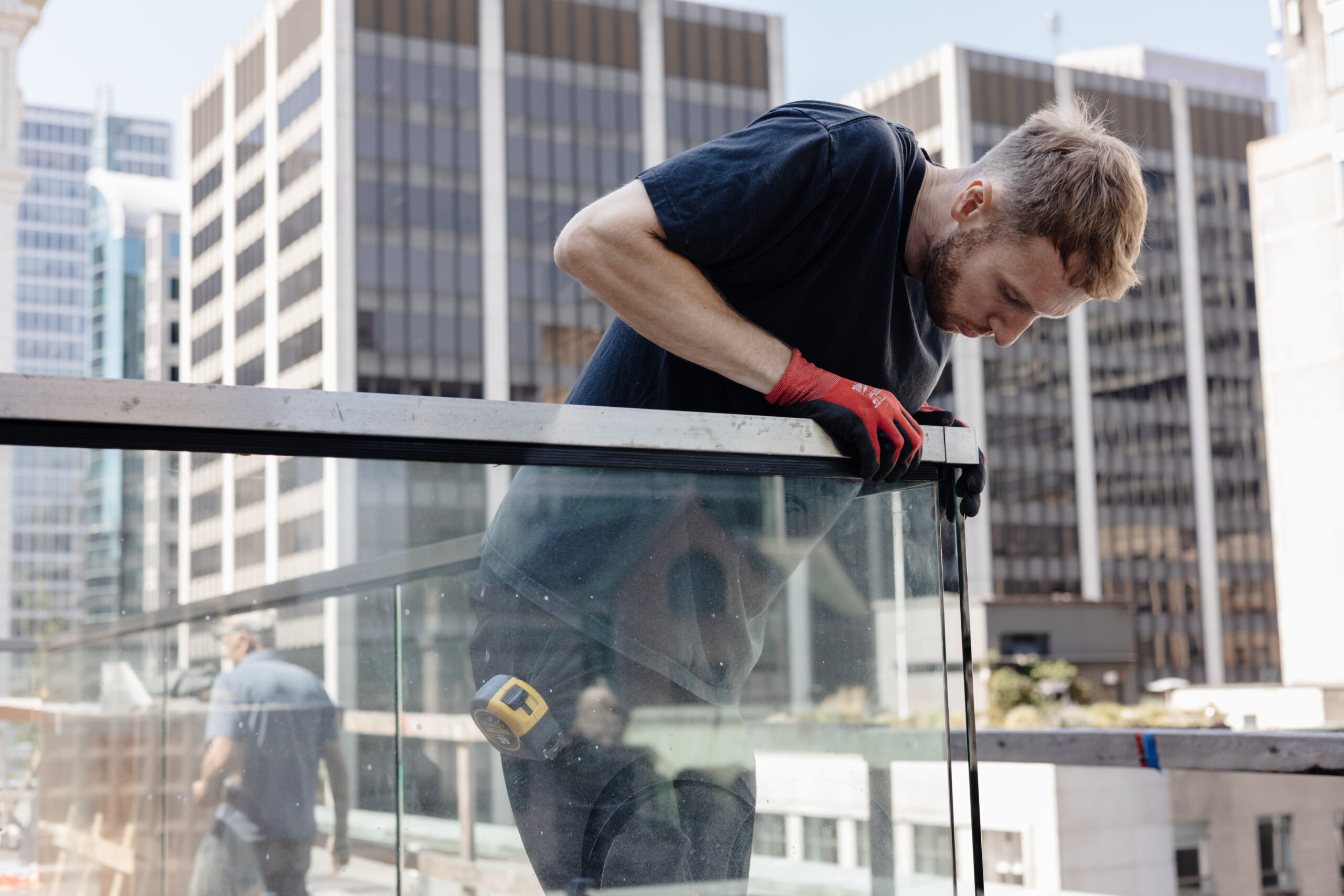 Island Glass & Mirror team installing a glass railing downtown Vancouver